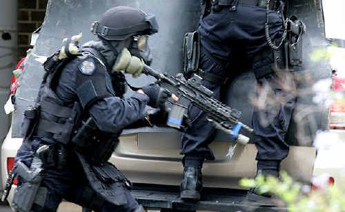 Queensland Police Special Emergency Response Team responds to a simulated small arms attack as part of Exercise Koala Amber at RAAF Base Amberley. Queensland Police Special Emergency Response Team responds to a simulated small arms attack as part of Exercise Koala Amber at RAAF Base Amberley.